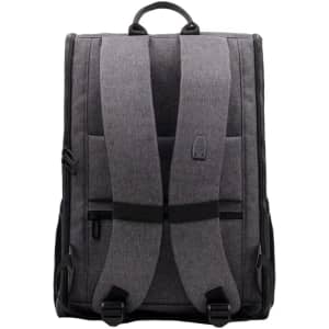 A grey backpack with padded straps and a top handle, featuring zippers and a logo on the front.