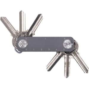 A keyring organiser featuring multiple silver keys and a clear measurement ruler. It has a simple, sleek design.