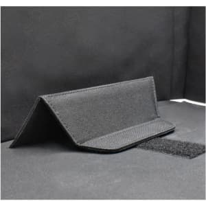 A black fabric laptop bag with a structured design and a Velcro closure. It features a textured surface.