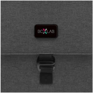 A grey laptop bag featuring a clip closure and a branded logo.
