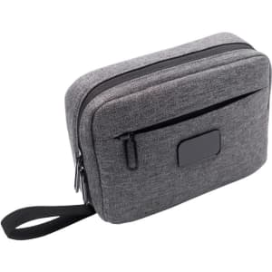 A grey toiletry bag with two zippered compartments and a side handle, featuring a logo on the front.