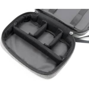 A grey toiletry bag with multiple compartments and a zip closure, featuring internal padding and organisation sections.
