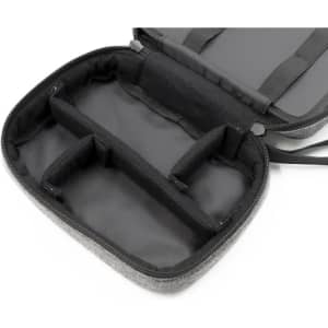 A grey toiletry bag with a zippered closure, featuring multiple inner compartments and a sleek black interior.