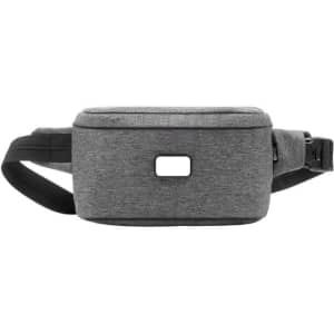 A grey anti-theft sling bag with a black strap and a logo on the front.
