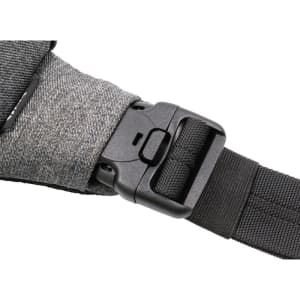 A grey fabric strap featuring a secure buckle and adjustable black webbing. The image displays part of a sling bag.