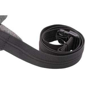 A grey anti-theft sling bag with an adjustable strap and a clip closure. It features a simple design and is quite compact.
