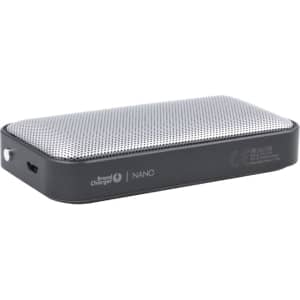 A sleek black Nano Vegan Wireless Speaker with a silver mesh top, featuring a logo and a charging port.