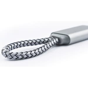 A grey and black braided charging cable with a flat connector, featuring a small logo on the body.