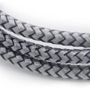 A close-up of a braided charging cable in grey and black, featuring a textured design and a logo.