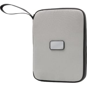 A grey travel wallet with a black accent, featuring a handle and a logo on the front.