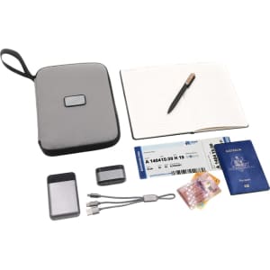 A grey travel wallet containing a notebook, pen, passport, boarding pass, cards, and charging cables.