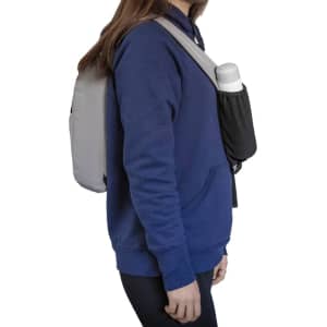 A grey Sling Eco Bag worn over a navy hoodie, featuring a side pouch for a drink bottle.