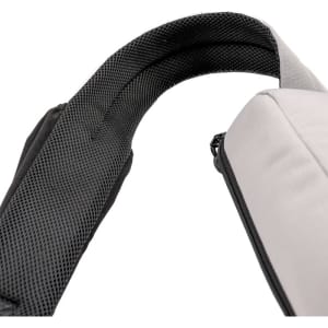 A grey eco bag with a black padded strap, featuring a textured interior. It includes a logo on the exterior.