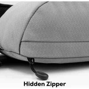 A grey Sling Eco Bag featuring a textured surface and a hidden zipper detail. Includes a logo on the side.