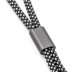 A black and white braided wristband strap with a matte black connector.