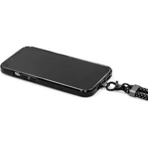 A black phone attached to a lanyard strap, featuring a textured design and a metal clip for secure carrying.