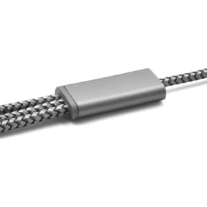 A charging cable in grey and black with a textured braided design and a metallic connector.