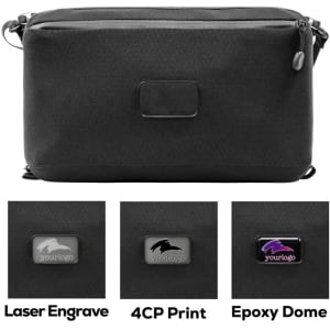 A black toiletry bag with various branding options displayed below, including laser engraving and print styles.