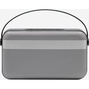 A premium wireless speaker in silver and black with a carrying handle and a sleek design.
