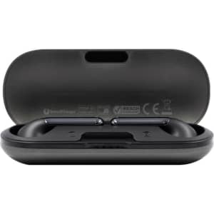 A black charging case with true wireless earbuds inside, featuring a sleek design and a logo on the front.