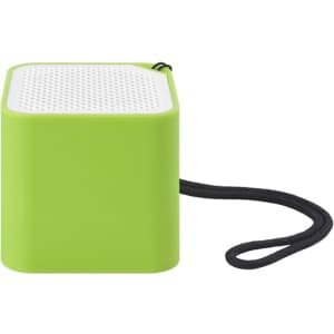 A green square speaker with a textured top and a black strap attached. It has a logo on one side.