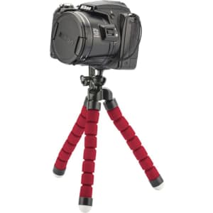 A red and black Flex Tripod with a camera mounted on top, featuring flexible legs and rubber feet.