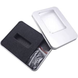 A silver tin with a PVC window, featuring a foam insert and contents visible through the window.