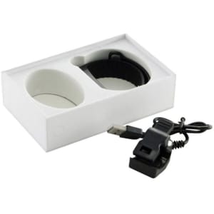 A white gift box containing two cups, a black wristband, and a USB charging cable, all neatly arranged inside.