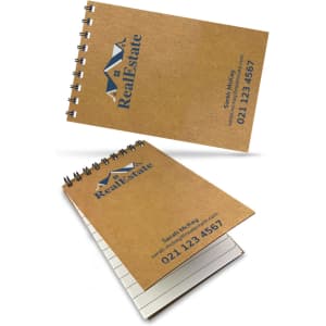 Aspiral-bound A7 notebook with a natural kraft cover and branding, featuring blank pages inside.