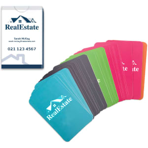 A set of playing cards in vibrant colours including blue, green, pink, black, and red, with a printed box.