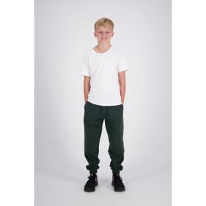 Reinforced knee sweatpants in dark green, modelled by a young boy wearing a white t-shirt and black shoes.