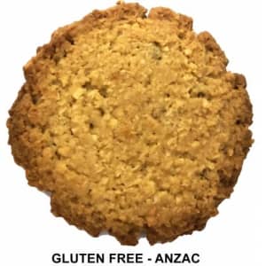 A round gluten-free biscuit with a golden-brown texture, featuring a rustic, crumbly appearance.