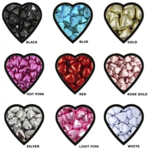 A collection of chocolate hearts in various colours: black, blue, gold, hot pink, red, rose gold, silver, light pink, and white.