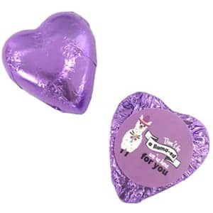 A purple chocolate heart wrapped in foil with a playful label featuring a llama.