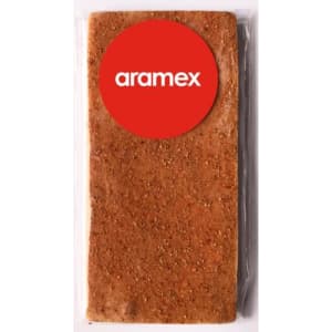 A rectangular chocolate bar with a smooth surface, featuring a prominent red circular logo.
