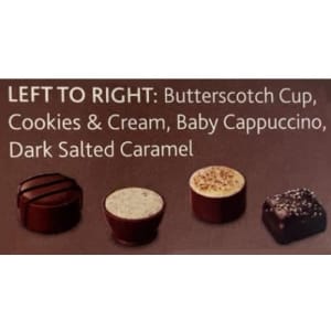 A box of four chocolates in brown and white: Butterscotch Cup, Cookies & Cream, Baby Cappuccino, Dark Salted Caramel.