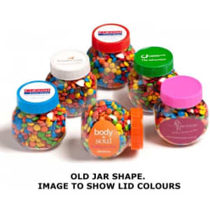 A jar filled with colourful M&Ms in various vibrant shades, featuring different lid colours and logos.