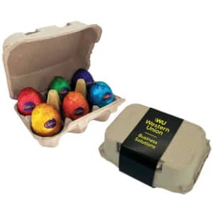 A carton containing six chocolate eggs in vibrant foil wrappers, with an accompanying branded packaging.