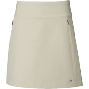 A light green skort with a fitted waistband and side pockets, featuring a logo on the front.