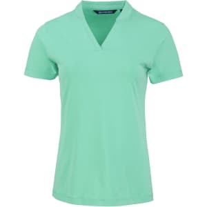 A mint green women's polo shirt with a v-neck design and a logo on the chest.