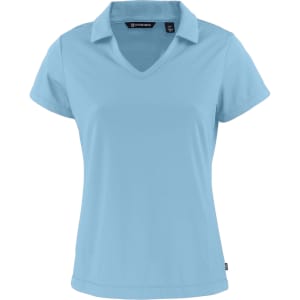 A light blue Ladies Daybreak Polo shirt with a V-neck and short sleeves, featuring a logo.