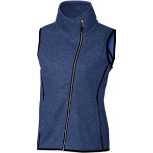 A blue ladies vest with a high collar, featuring a zip closure and contrasting stitching. It has a logo on it.