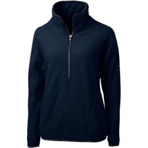 A dark navy half zip jacket made from eco-friendly Sherpa fabric, featuring a high collar and a logo on the sleeve.