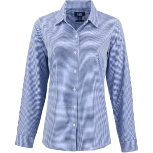 A blue gingham check women's shirt with a button-down front and long sleeves. It features a logo on the label.