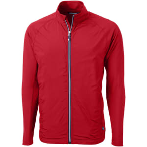 A red full zip jacket with long sleeves, featuring a stand-up collar and a branded logo.