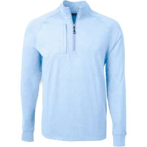 A light blue half-zip jumper featuring a chest pocket and a logo on the front.