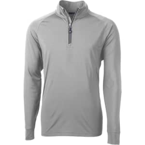 A light grey half-zip jumper with long sleeves, featuring a zippered collar and a discreet logo.