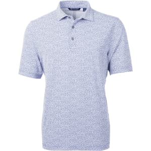 A men's short-sleeve polo shirt in light blue with a botanical print and a collar. Features a logo on the chest.