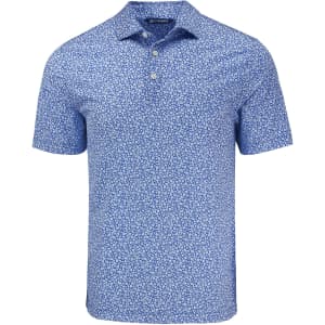 A blue polo shirt featuring a floral print, with a collar and three-button placket, includes a logo.