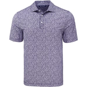 A navy polo shirt with a floral print design, featuring a three-button placket and short sleeves. It has a logo on the chest.